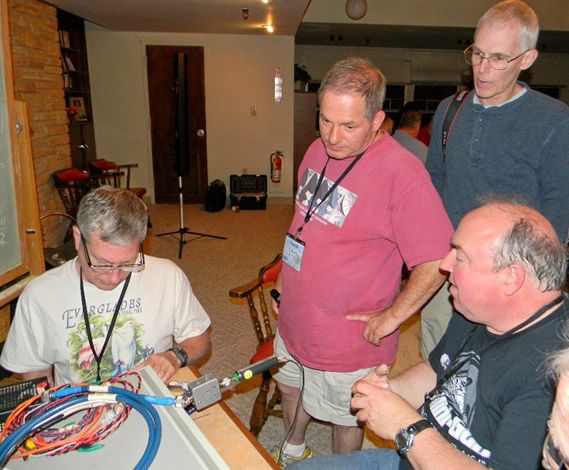 Text Box: L to R- Carl Lyster, David Cohen, James Thompson and Charles Osborne doing noise figure testing in the Drake Lounge.